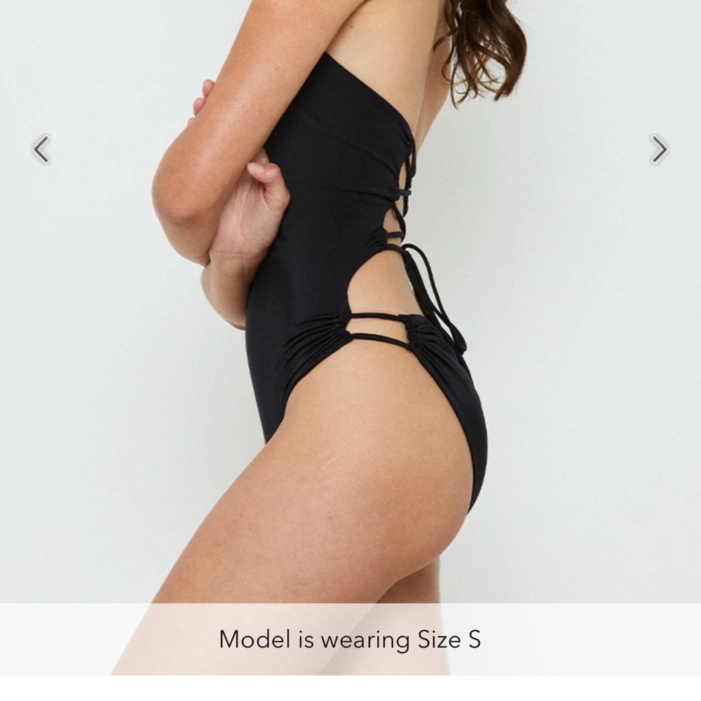 In a Ruche Swimsuit. NWT onepiece swimsuit by we are Haht